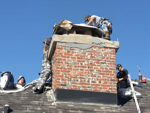 South Gate Chimney Sweep installing a custom chimney crown in South Gate, CA