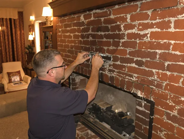 South Gate Chimney Sweep expert fixing a fireplace in South Gate, CA